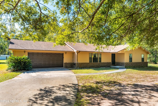 ranch-style house featuring a garage