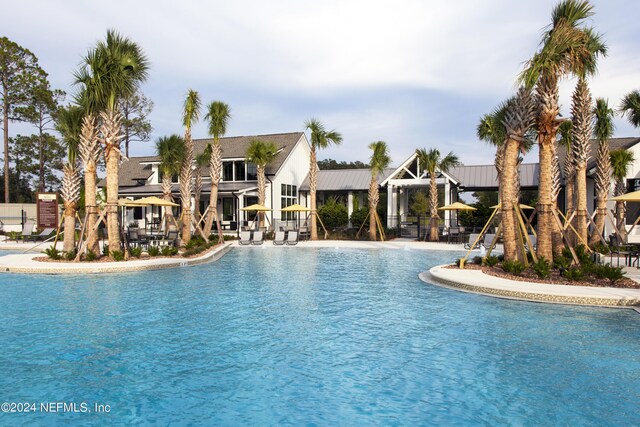 community pool with a patio area