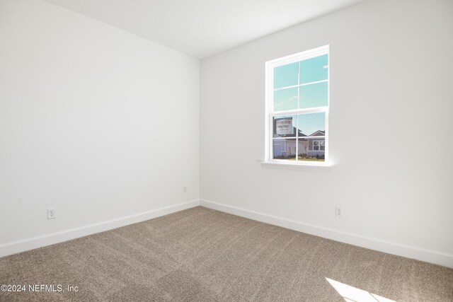 2523 Trailmark Dr, Saint Augustine, FL 32092 - carpeted spare room featuring baseboards