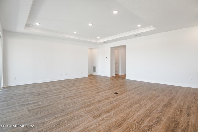 2523 Trailmark Dr, Saint Augustine, FL 32092 - empty room featuring recessed lighting, light wood finished floors, a raised ceiling, and baseboards