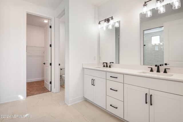 2523 Trailmark Dr, Saint Augustine, FL 32092 - bathroom with a stall shower, toilet, marble finish floor, and a sink