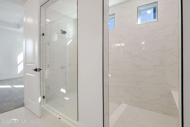 2523 Trailmark Dr, Saint Augustine, FL 32092 - full bathroom featuring a healthy amount of sunlight, a marble finish shower, and marble finish floor