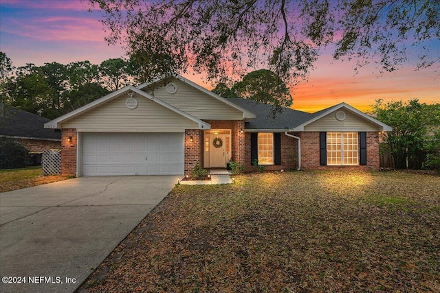 ranch-style house featuring a garage