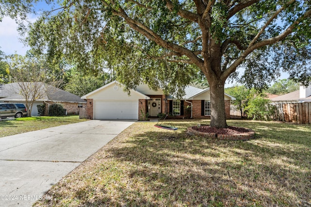 ranch-style house with a front lawn and a garage