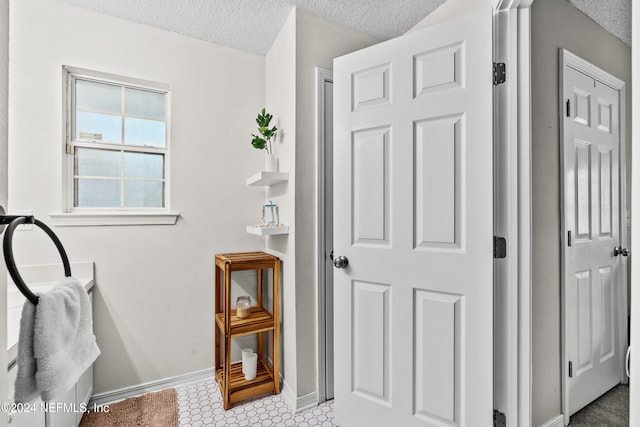 bathroom featuring a textured ceiling