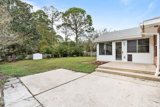 view of patio with a storage shed