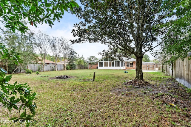 view of yard featuring a sunroom