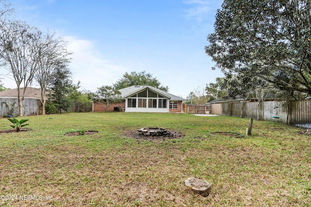 view of yard featuring a sunroom