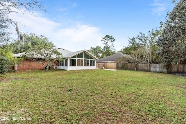 view of yard with a sunroom