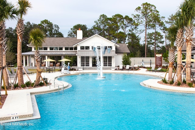 view of pool featuring a patio area and pool water feature