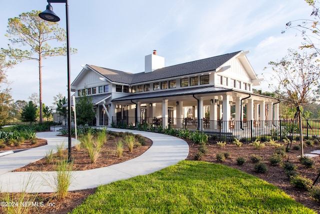 back of property with covered porch