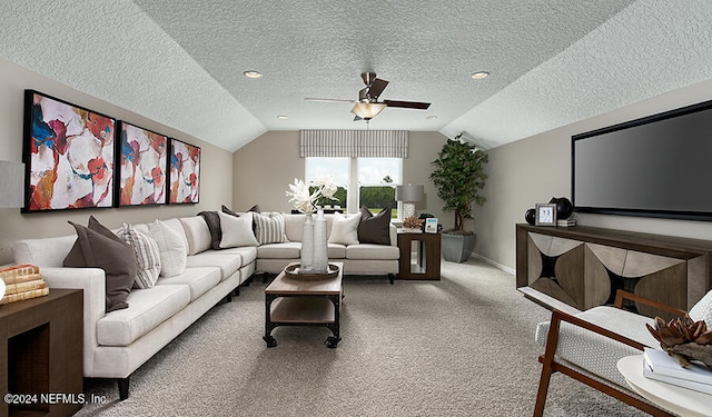 living room with lofted ceiling, carpet floors, a textured ceiling, and ceiling fan