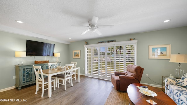 interior space with a textured ceiling, dark hardwood / wood-style flooring, and ceiling fan