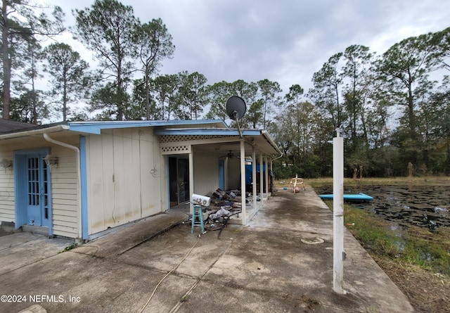 exterior space featuring ceiling fan