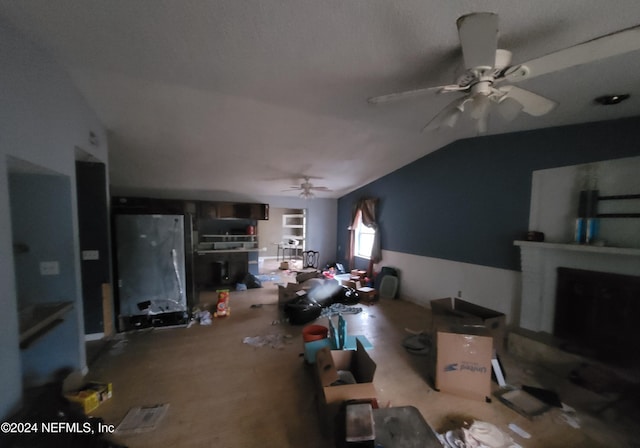 living room with lofted ceiling and ceiling fan