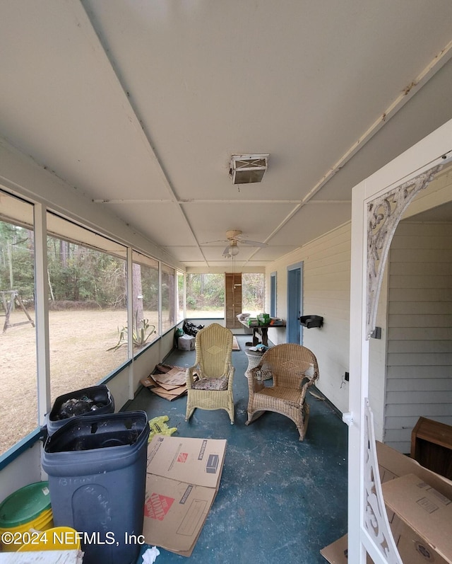 sunroom / solarium with ceiling fan