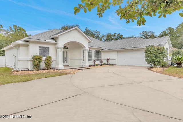 ranch-style home featuring a garage