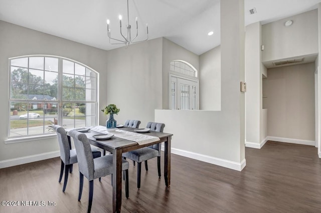 dining area featuring a chandelier and dark wood-type flooring