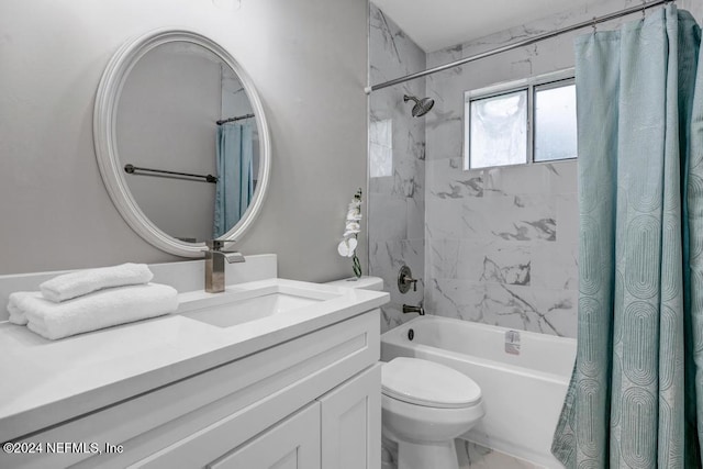 full bathroom featuring vanity, shower / tub combo with curtain, and toilet