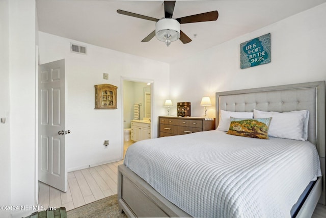 bedroom featuring ensuite bathroom and ceiling fan