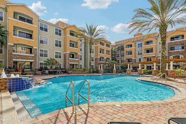 view of pool with pool water feature