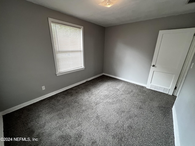 empty room featuring carpet flooring