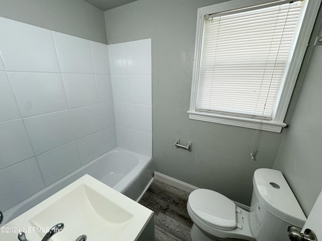 bathroom with toilet and hardwood / wood-style floors