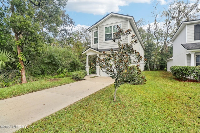 view of front facade featuring a garage and a front lawn