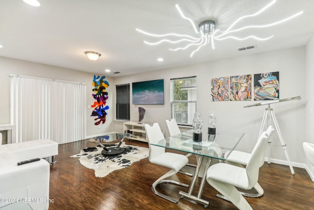 dining area with dark hardwood / wood-style flooring