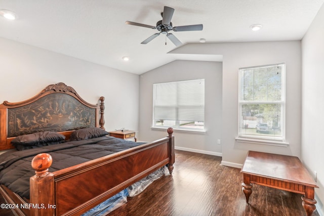 bedroom with dark hardwood / wood-style flooring, lofted ceiling, and ceiling fan