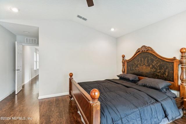 bedroom with ceiling fan, dark hardwood / wood-style floors, and lofted ceiling