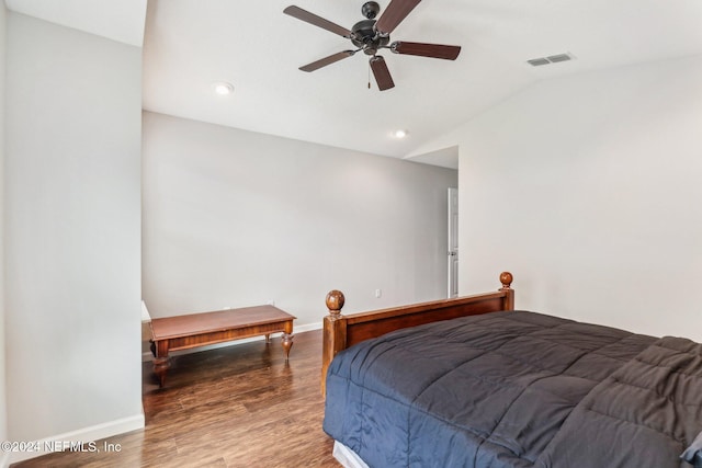 bedroom with dark wood-type flooring, ceiling fan, and vaulted ceiling