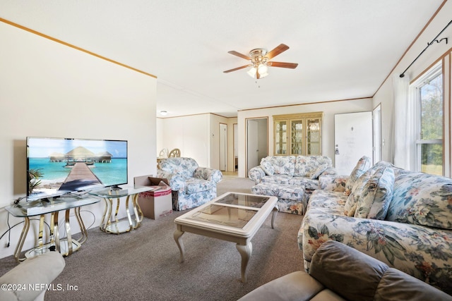 carpeted living room featuring crown molding and ceiling fan