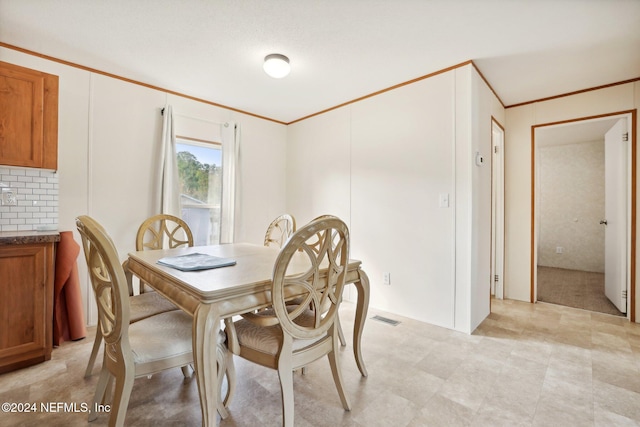 dining room with ornamental molding