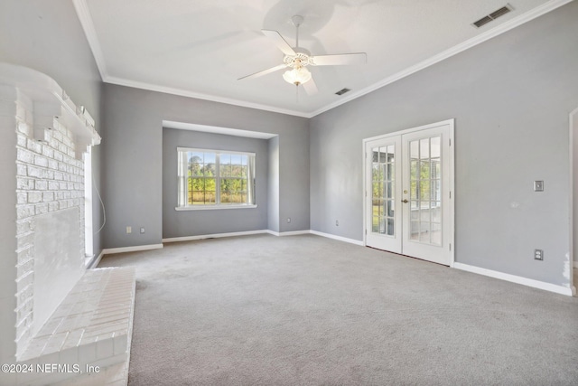 carpeted spare room featuring ornamental molding, french doors, and ceiling fan