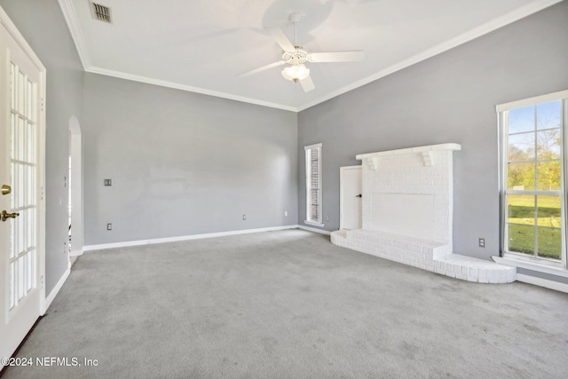 unfurnished living room with ornamental molding, carpet floors, and ceiling fan