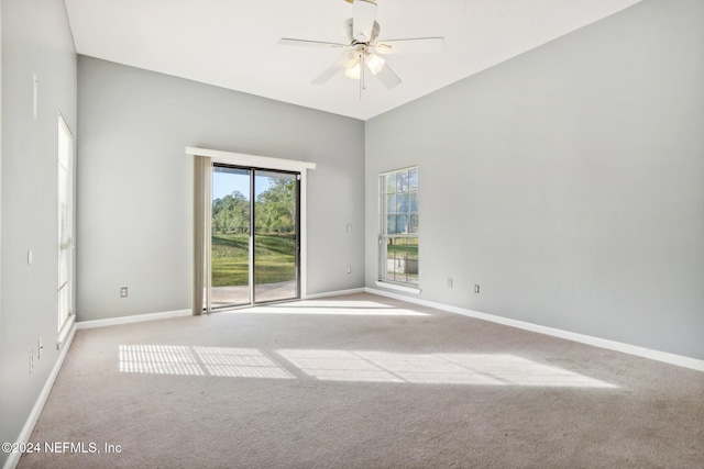 carpeted empty room featuring ceiling fan