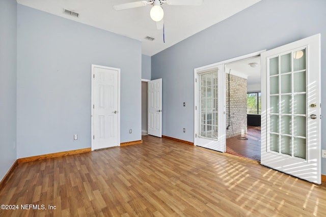 empty room featuring ceiling fan and hardwood / wood-style floors