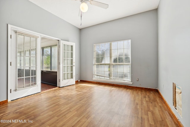 empty room with wood-type flooring and ceiling fan