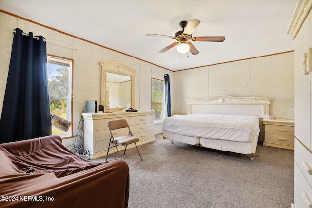 bedroom featuring crown molding, carpet, and ceiling fan