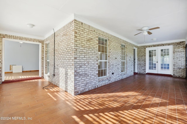 interior space with french doors and ceiling fan