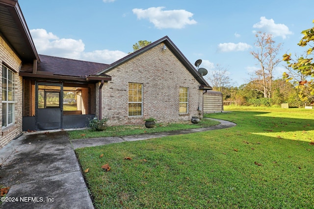 view of home's exterior featuring a lawn