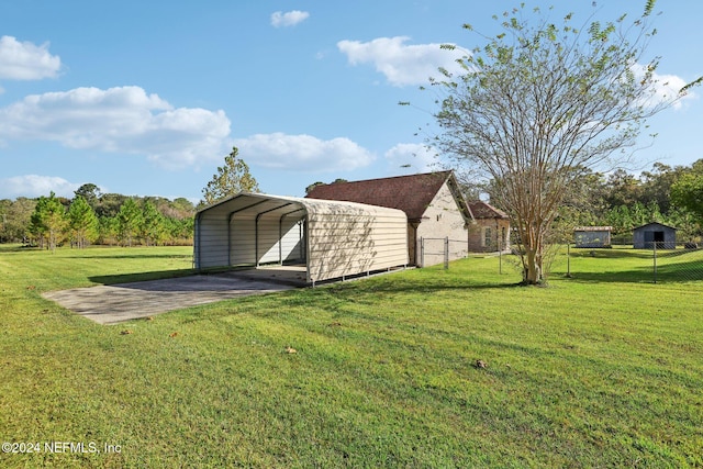 view of outbuilding with a lawn and a carport