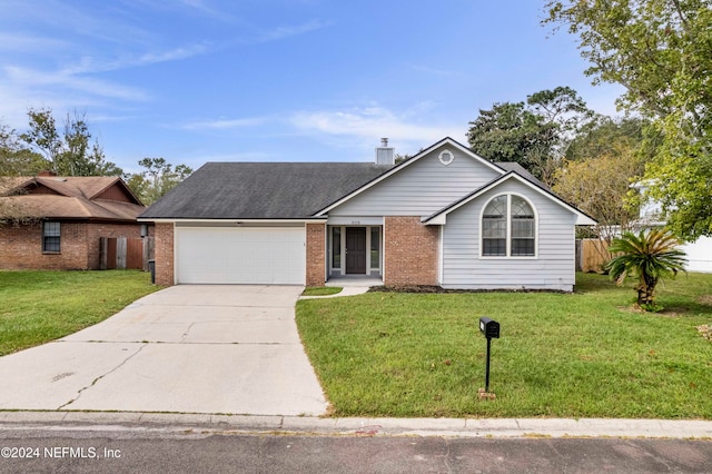 single story home featuring a front lawn and a garage