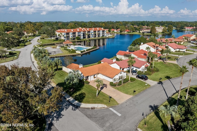 bird's eye view with a water view and a residential view