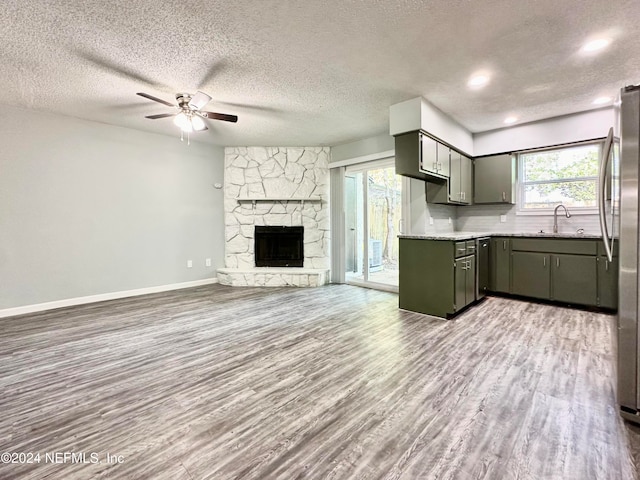 kitchen featuring a textured ceiling and wood-type flooring