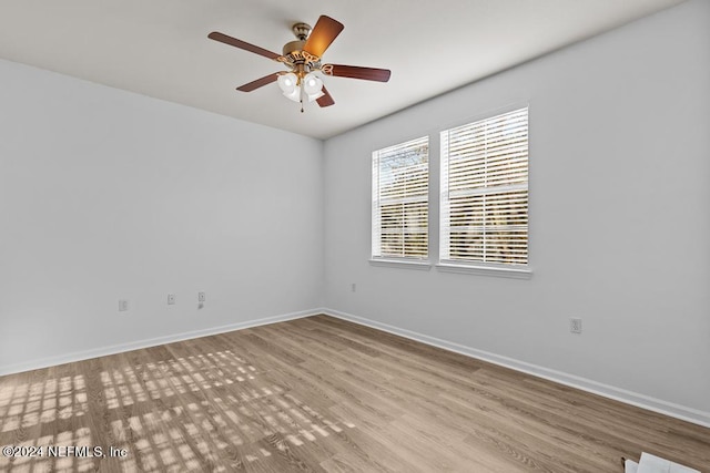 unfurnished room featuring light hardwood / wood-style floors and ceiling fan