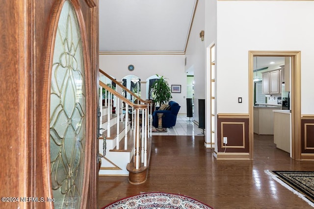 entryway featuring crown molding and wood-type flooring