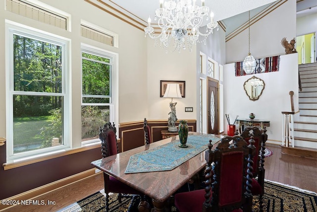 dining room featuring an inviting chandelier, hardwood / wood-style floors, and plenty of natural light