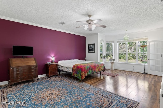 bedroom with ceiling fan, crown molding, a textured ceiling, and hardwood / wood-style floors